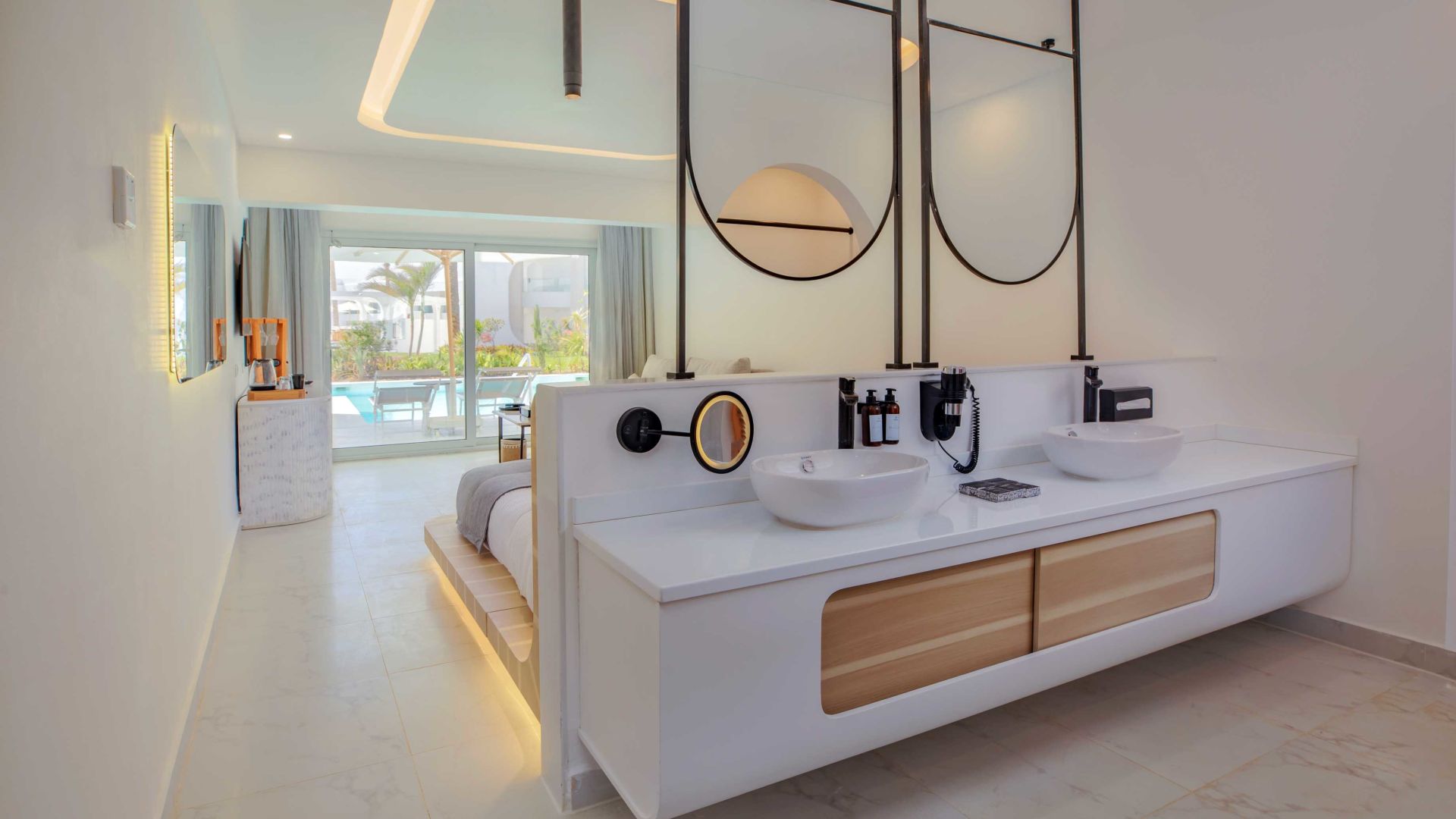 A Bathroom With Sinks And Mirrors